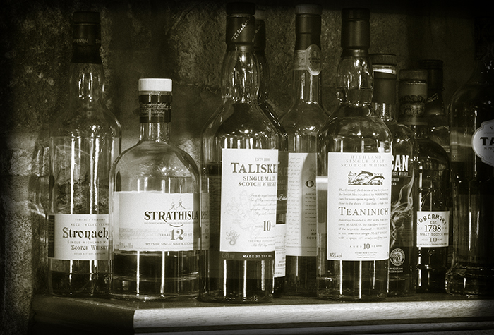 Bottles behind the bar at the Huntly Castle Hotel in Huntly, Scotland. Photo ©2016, Mark Gillespie, CaskStrength Media. Bottles behind the bar at the Huntly Castle Hotel in Huntly, Scotland. Photo ©2016, Mark Gillespie, CaskStrength Media.