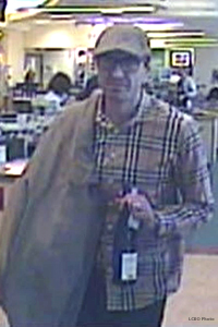 The suspect in the theft of a bottle of Glenfiddich 50 from the LCBO Queen's Quay store in Toronto. Photo courtesy LCBO via National Post. 
