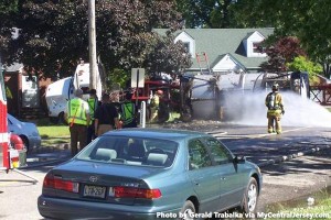 Firefighters and police respond to a tanker truck of Scotch whisky that crashed and caught fire in Woodbridge, New Jersey Wednesday, June 5, 2013. Photo by Gerald Trabalka via MyCentralJersey.com. 