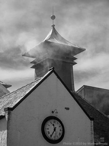 Peat smoke coming from the pagoda at Laphroaig Distillery on Islay. Photo © 2010 by Mark Gillespie.
