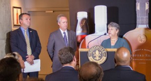 Dr. Janet Kelly (R) of the University of Louisville presents findings of the Urban Studies Institute's economic impact study on September 20, 2013 at a news conference in Louisville. At far left is Kentucky Distillers Association Chairman Rick Robinson of Wild Turkey (L) and Louisville Mayor Greg Fischer. Photo © 2013 by Mark Gillespie. 