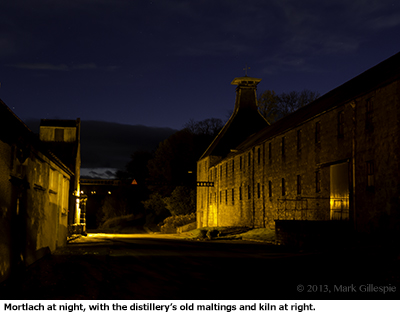The Mortlach Distillery at night, with the former maltings and kiln shown at right. Photo ©2013 by Mark Gillespie.