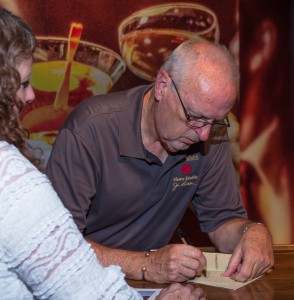 Former Four Roses Master Distiller Jim Rutledge signs an autograph during the Kentucky Bourbon Festival on September 18, 2013. Photo ©2013 by Mark Gillespie.