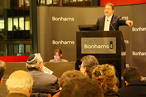 Bonhams Co-Chairman Malcolm Barber conducts a whisky auction December 8, 2011 at the Bonhams gallery in New York City. Photo ©2011 by Mark Gillespie.