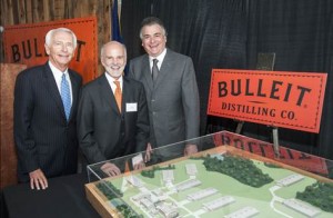 Kentucky Gov. Steve Beshear, Tom Bulleit, and Diageo North America President Larry Schwartz gather around a 3D model of the new Bulleit Distilling Co. distillery on which they helped break ground August 21, 2014. Image courtesy Diageo.