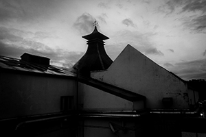 Clouds over Craigellachie Distillery in Scotland. Photo ©2014 by Mark Gillespie.