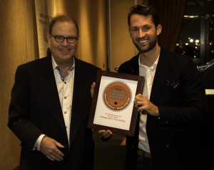 Canadian Whisky Awards founder Davin de Kergommeaux presents the Canadian Whisky of the Year Award to Brown-Forman's Chase Stampe February 15, 2015. Photo ©2015 by Mark Gillespie.