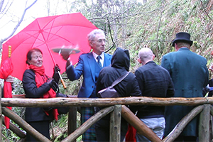 Glen Grant Distillery Manager Dennis Malcolm serves guests a dram during a tour of the distillery's gardens during the Spirit of Speyside Festival May 3, 2015. Photo ©2015 by Mark Gillespie.