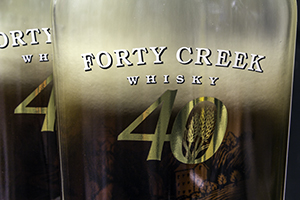 Forty Creek Whisky bottles being filled at the Grimsby, Ontario distillery. Photo ©2013 by Mark Gillespie.