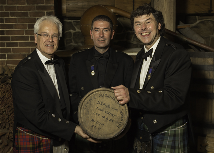 Distillers Andy Cant, John Campbell, and Bill Lumsden with one of the casks used to mature George Washington's Single Malt October 13, 2015. Photo ©2015 by Mark Gillespie.
