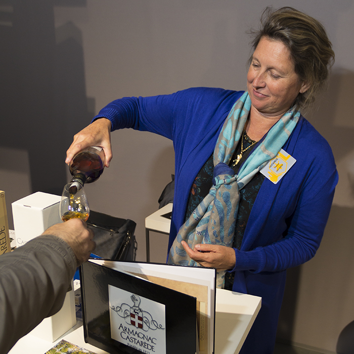 Florence Castarède of Armagnac Castarède pours a sample during Whisky Live Paris September 29, 2015. Photo ©2015 by Mark Gillespie. 