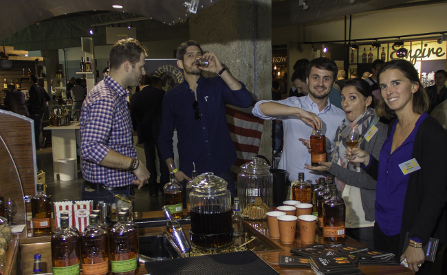French whisky connoisseurs gather at a Bulleit Bourbon display during Whisky Live Paris in September, 2015. Photo ©2015 by Mark Gillespie.
