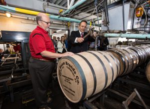 Kentucky Governor Matt Bevin hammers the bung into Jim Beam’s 14 millionth barrel, May 2, 2016, at the Jim Beam American Stillhouse in Clermont, Kentucky with Fred Noe, Jim Beam’s great-grandson and seventh generation master distiller. Photo courtesy Beam Suntory. 
