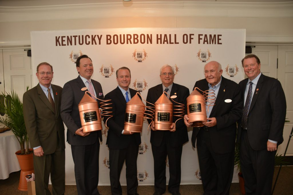 Chris Morris, Master Distiller at Brown-Forman and Chairman of the Kentucky Distillers’ Association Board of Directors, and KDA President Eric Gregory welcome the 2016 class of the Kentucky Bourbon Hall of Fame. Pictured are Morris; Barry Becton, Diageo North America; Paul Varga, President & CEO of Brown-Forman, accepting on behalf of Bill Street; John Rhea, retired COO of Four Roses Distillery; Jimmy Russell, Master Distiller at Wild Turkey and recipient of the Parker Beam Lifetime Achievement Award; and Gregory. Not pictured is Joy Perrine. Photo courtesy Kentucky Distillers Association.