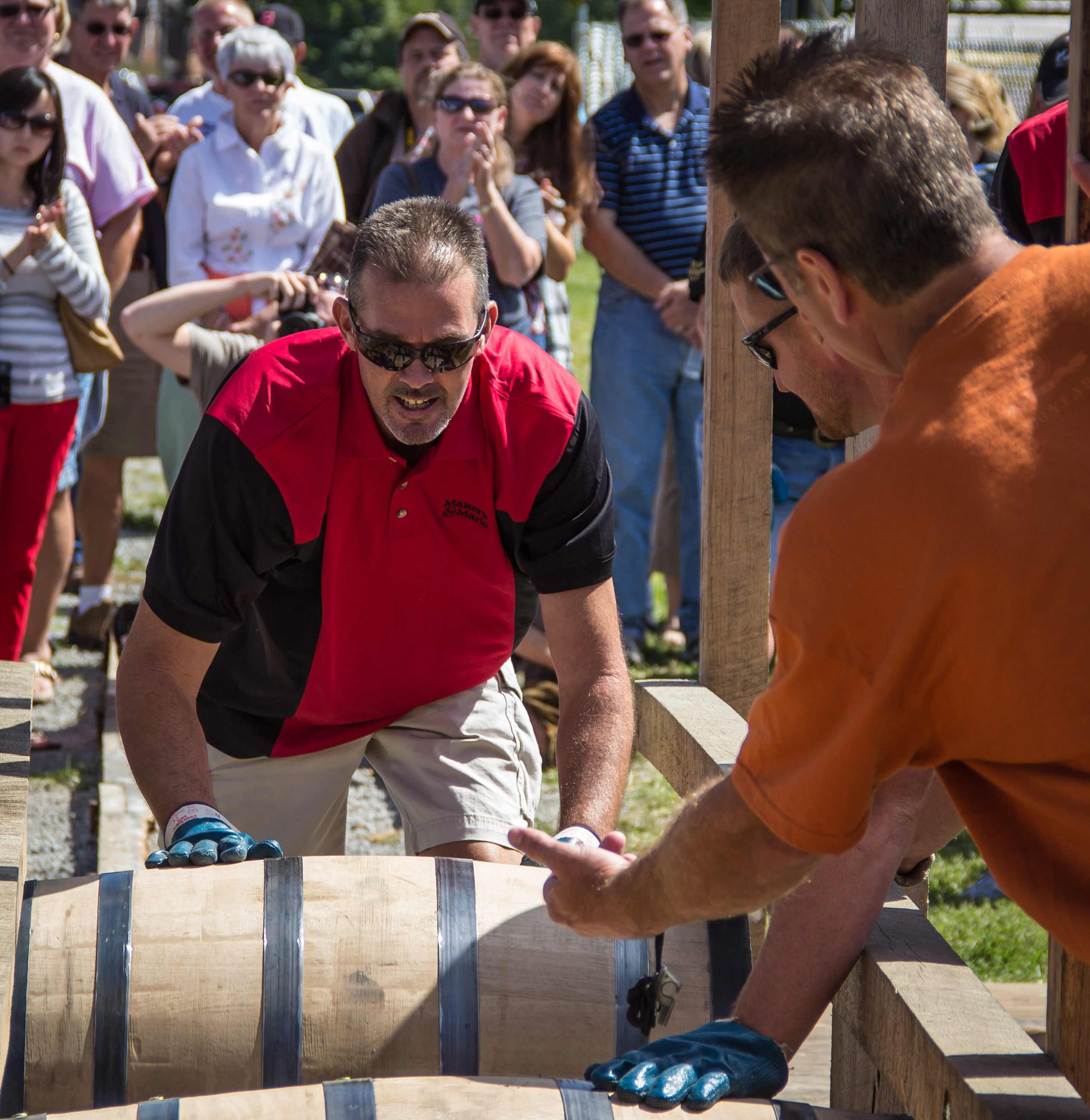 Members of the Maker's Mark team compete in the 2012 World Championship Bourbon Barrel Relay at the Kentucky Bourbon Festival in Bardstown, Kentucky.