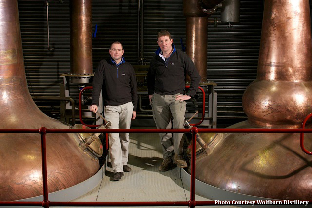 Wolfburn Distillery Production Manager Shane Fraser (L) and Assistant Production Manager Matt Beeson in the Wolfburn stillhouse.