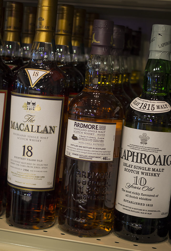 Scotch Whisky bottles on a demonstration retail shelf. Photo ©2013 by Mark Gillespie.