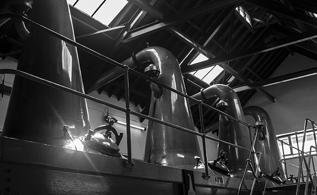 The stills at Longmorn Distillery in Scotland. Photo ©2010 by Mark Gillespie.