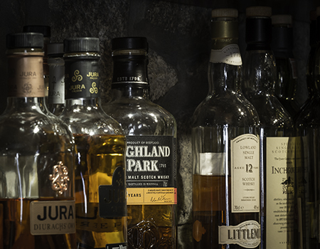 Whiskies on the shelf at a Scottish pub. Photo ©2016, Mark Gillespie/CaskStrength Media.