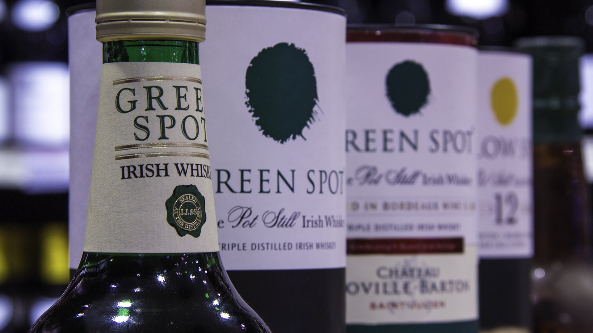 Green Spot bottles past and present at Mitchell & Son in Dublin. Photo ©2017, Mark Gillespie/CaskStrength Media.