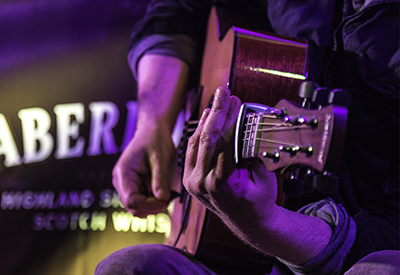 A guitarist performs during a Spirit of Speyside Festival concert in Aberlour, Scotland in 2015. Photo ©2015, Mark Gillespie/CaskStrength Media.
