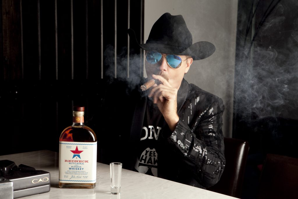 Country music star John Rich with the "Redneck Riviera" whiskey created in partnership with Eastside Distilling. Photo courtesy Eastside Distilling.