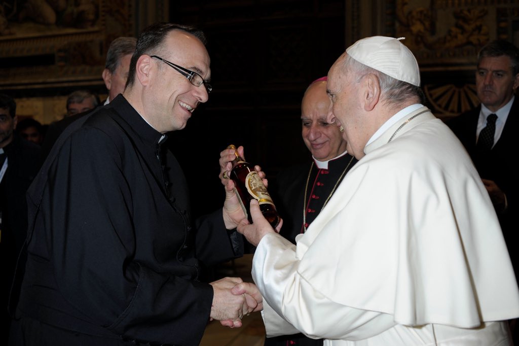 Fr. Jim Sichko (L) presents a bottle of Pappy Van Winkle Bourbon to Pope Francis at the Vatican April 10, 2018. Vatican Photo courtesy Fr. Jim Sichko.