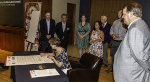 Scotch Whisky Association CEO Karen Betts signs a joint resolution at the "Spirit of Collaboration Summit" news briefing in Louisville, Kentucky July 26, 2018. Photo ©2018, Mark Gillespie/CaskStrength Media. 