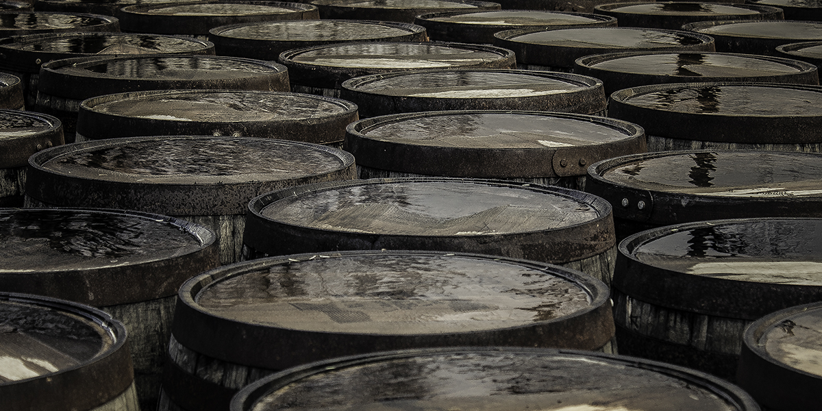 Whisky barrels lined up at a Scotch Whisky distillery. File photo ©2018, Mark Gillespie/CaskStrength Media.