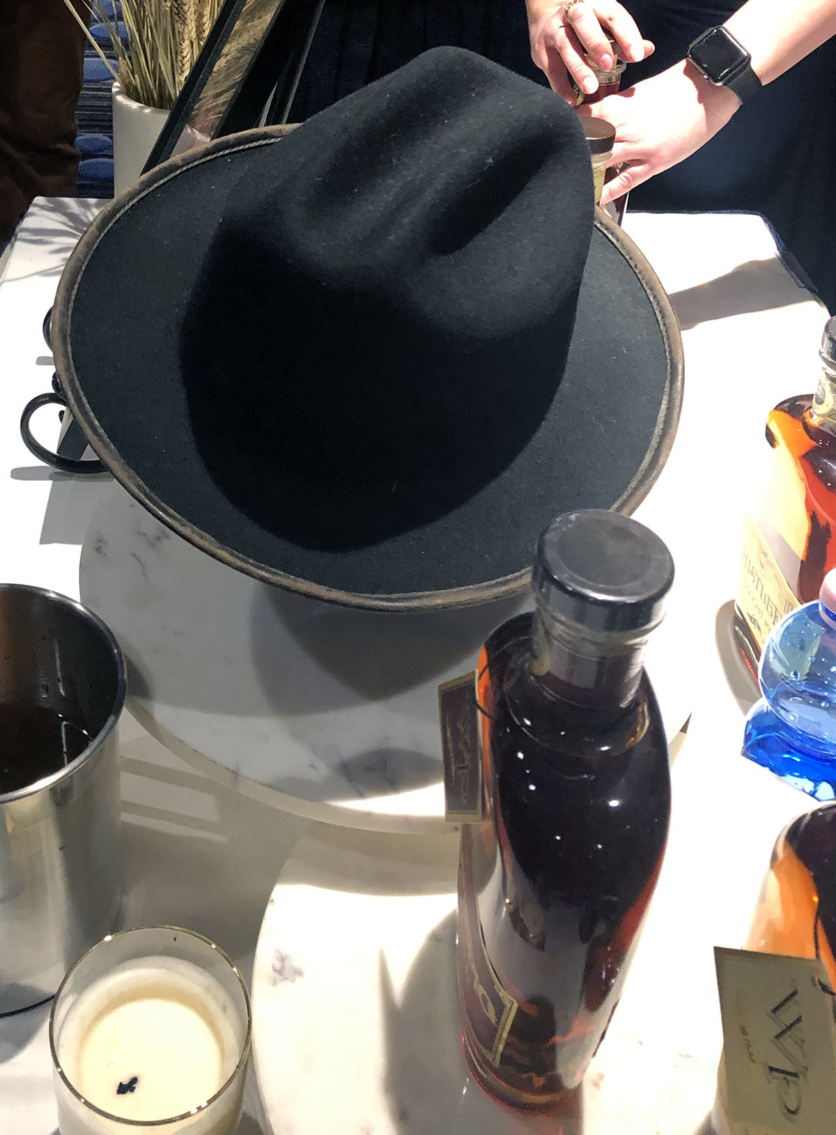 One of Dave Pickerell's hats displayed as a tribute to the late distiller at the WhistlePig Rye stand during WhiskyFest December 4, 2018 in New York City. Photo ©2018, Mark Gillespie/CaskStrength Media.