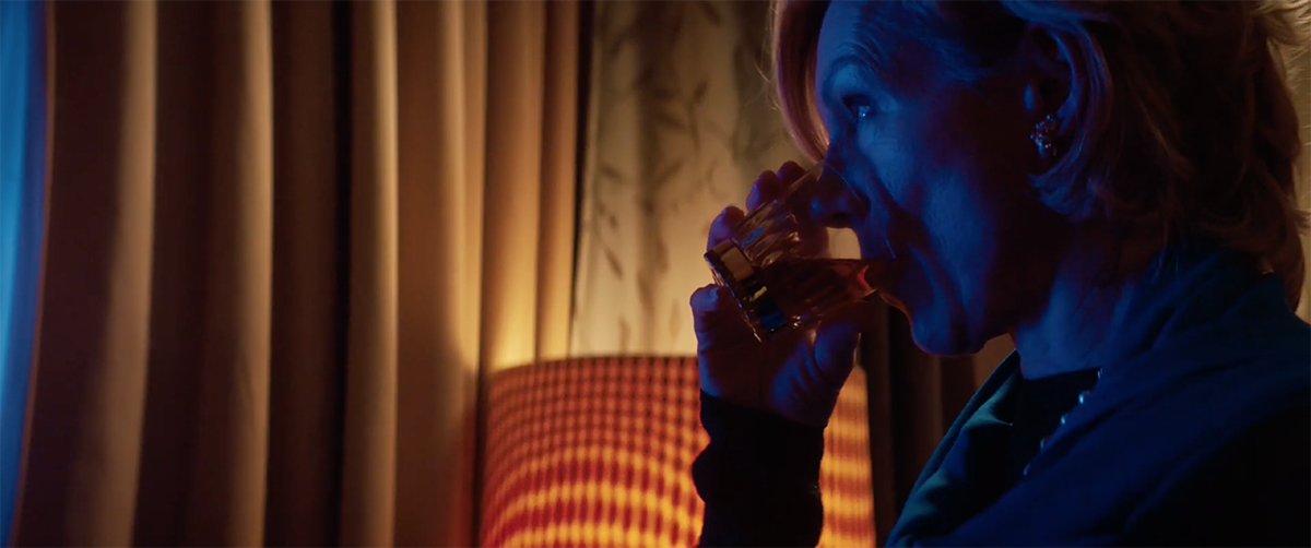 Juliet Stevenson sips a glass of Dewar's in a scene from "Four." Image courtesy Platform Presents and Dewar's.