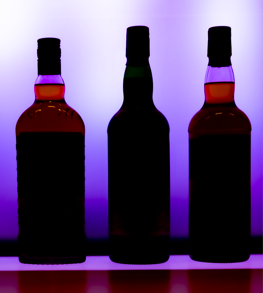 Scotch Whisky bottles in silhouette. Photo ©2020, Mark Gillespie/CaskStrength Media