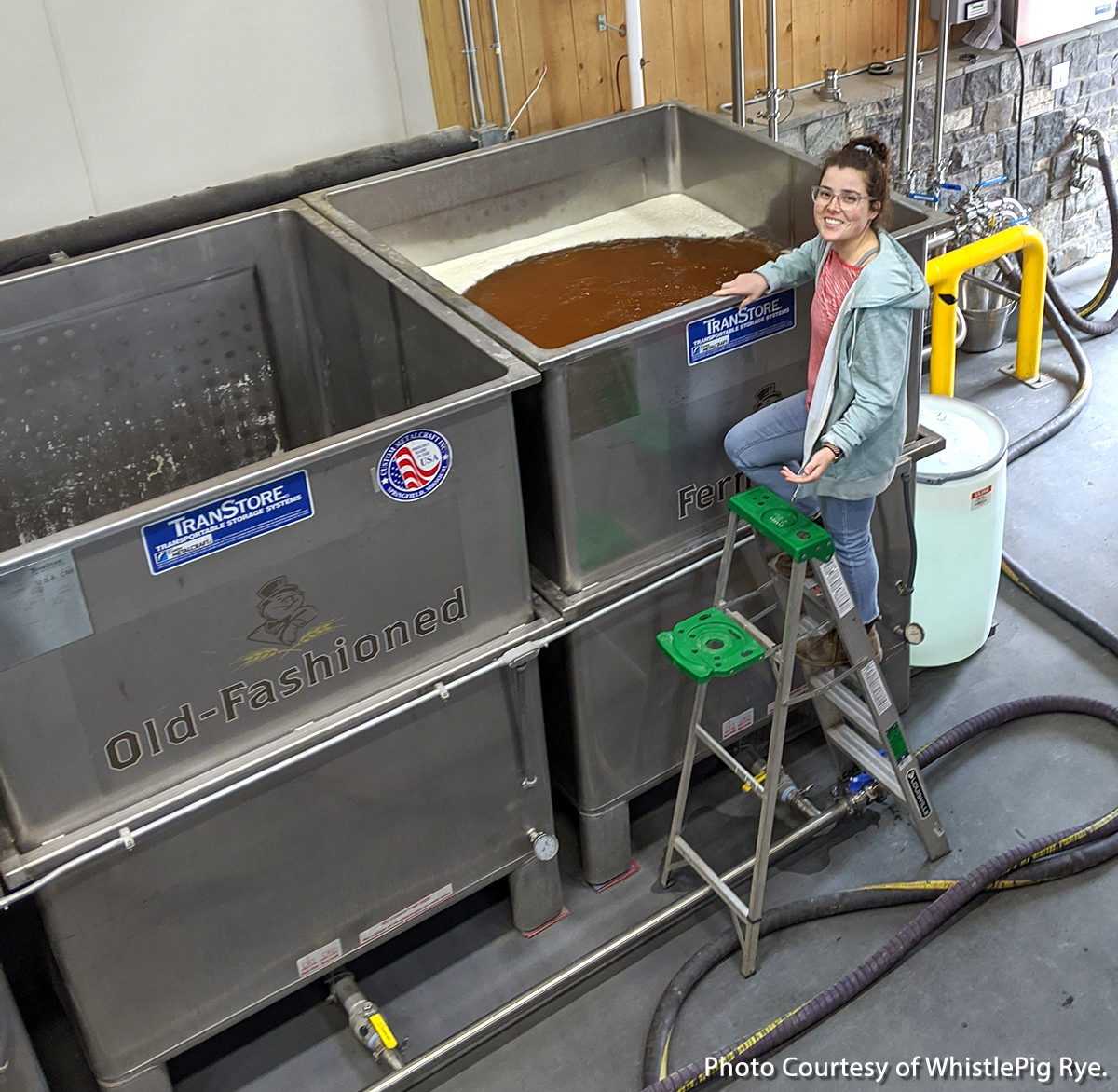 WhistlePig Farm distillery manager Emily Harrison fills a fermenter with surplus beer to be distilled into whisky. Photo courtesy WhistlePig Whiskey.