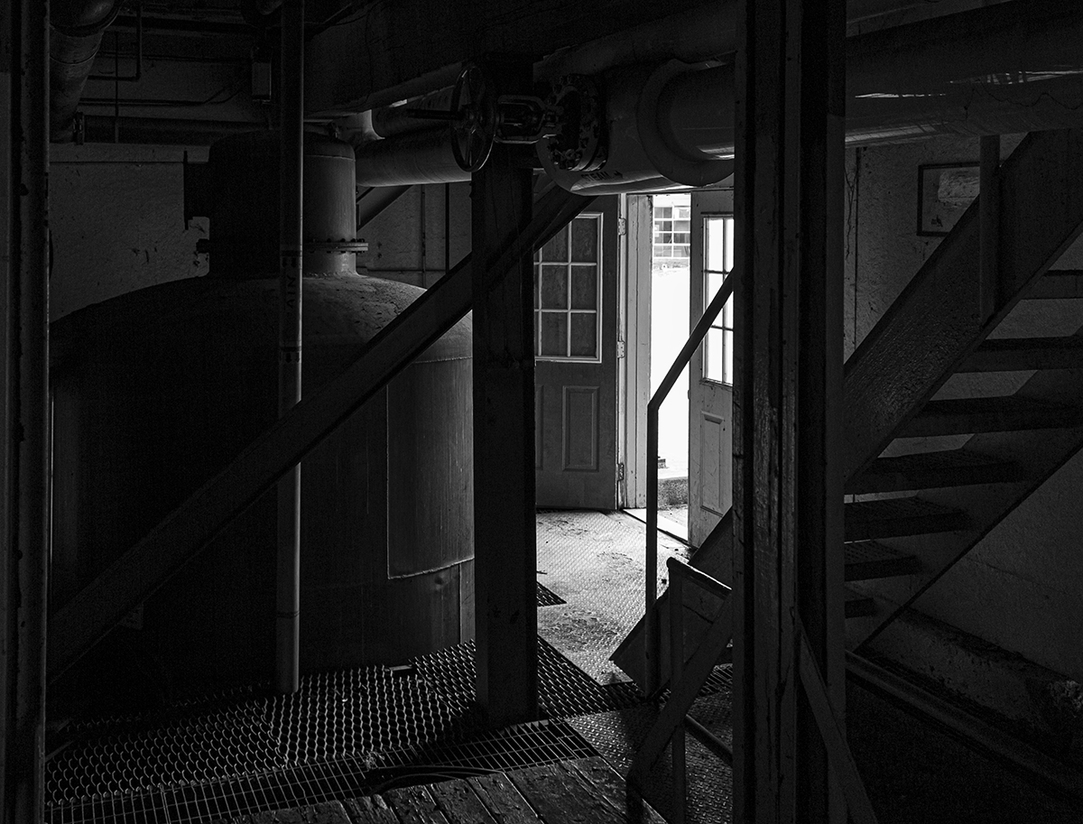 Hard to believe it's been nine years since Wild Turkey opened its current distillery just up the road from the original site. After the dedication in June of 2011, a member of the Ripy family took me to the old distillery, which had already been stripped of everything that could be salvaged. This is the view from the first floor of the stillhouse, with the "doubler" pot still just inside the door. Photo ©2020, Mark Gillespie/CaskStrength Media. Hard to believe it's been nine years since Wild Turkey opened its current distillery just up the road from the original site. After the dedication in June of 2011, a member of the Ripy family took me to the old distillery, which had already been stripped of everything that could be salvaged. This is the view from the first floor of the stillhouse, with the "doubler" pot still just inside the door.