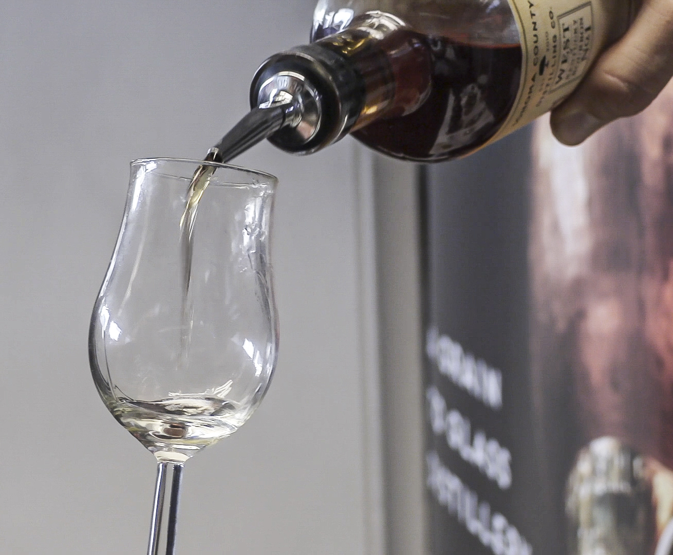 Whisky being poured into a glass during a whisky festival. File photo ©2020, Mark GIllespie/CaskStrength Media.