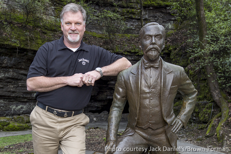 Jeff Arnett poses with the statue of Jack Daniel at the Jack Daniel Distillery in Lynchburg, Tennessee. Photo courtesy Jack Daniel's/Brown-Forman.