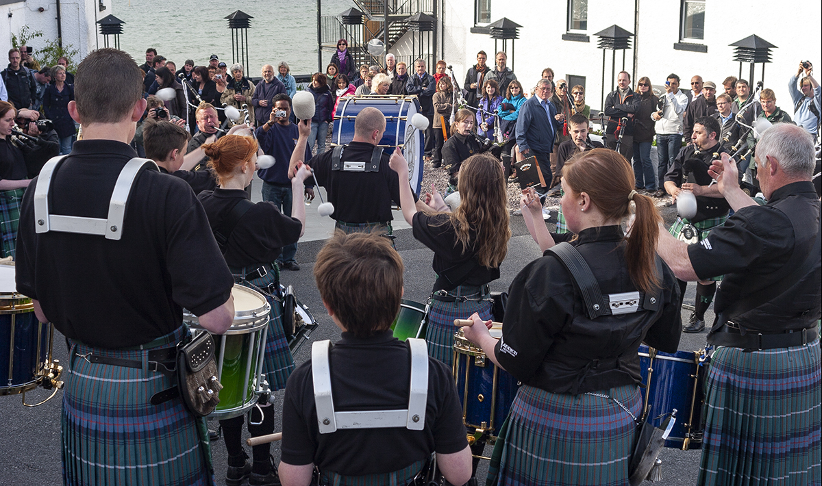 Islay's pipe band performs during a Fèis Ile celebration at Bowmore Distillery in 2010. File photo ©2021, Mark Gillespie/CaskStrength Media.