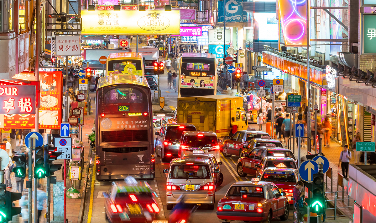 A busy street in Hong Kong's Mong Kok shopping district. Photo courtesy Adobe Stock.