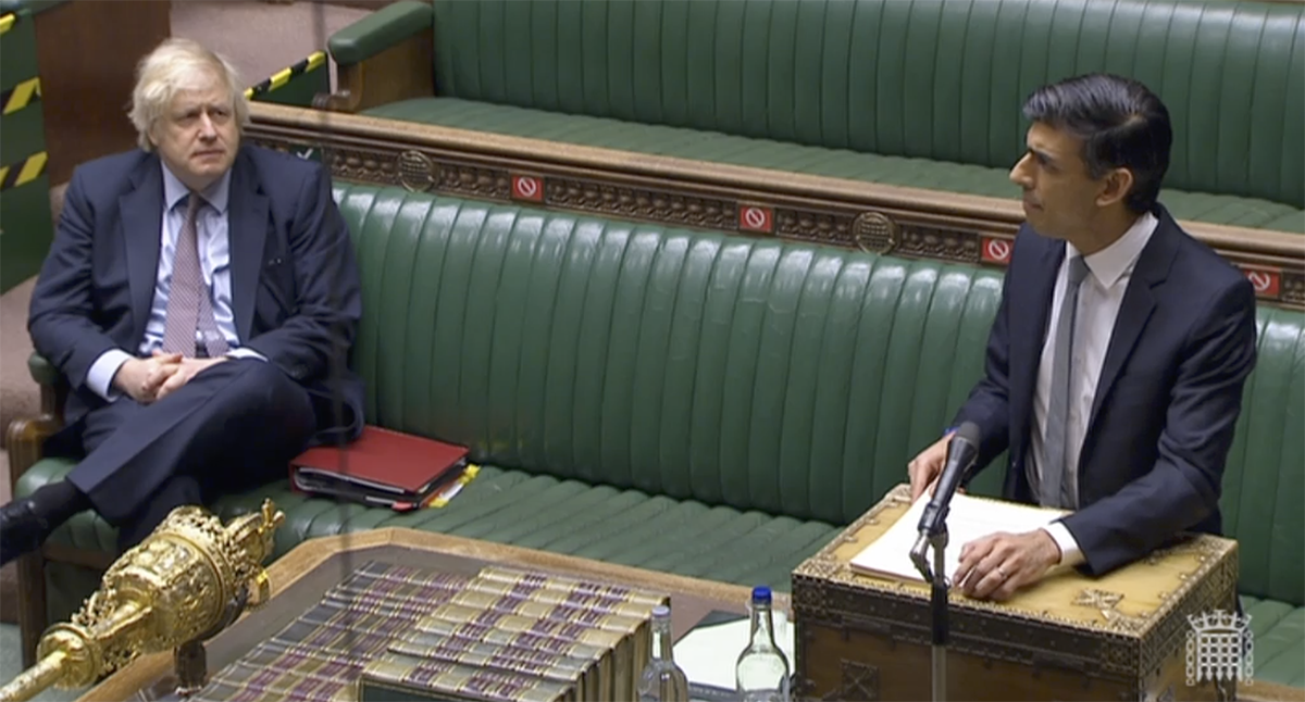 British Prime Minister Boris Johnson looks on as Chancellor Rishi Sunak outlines the government's new budget to Parliament March 3, 2021. Image courtesy Parliament TV.