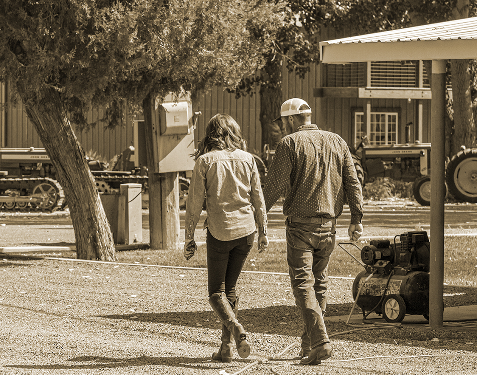 Ashley and Colby Frey walking at their farm and distillery in Fallon, Nevada. Photo ©2021, Mark Gillespie/CaskStrength Media.