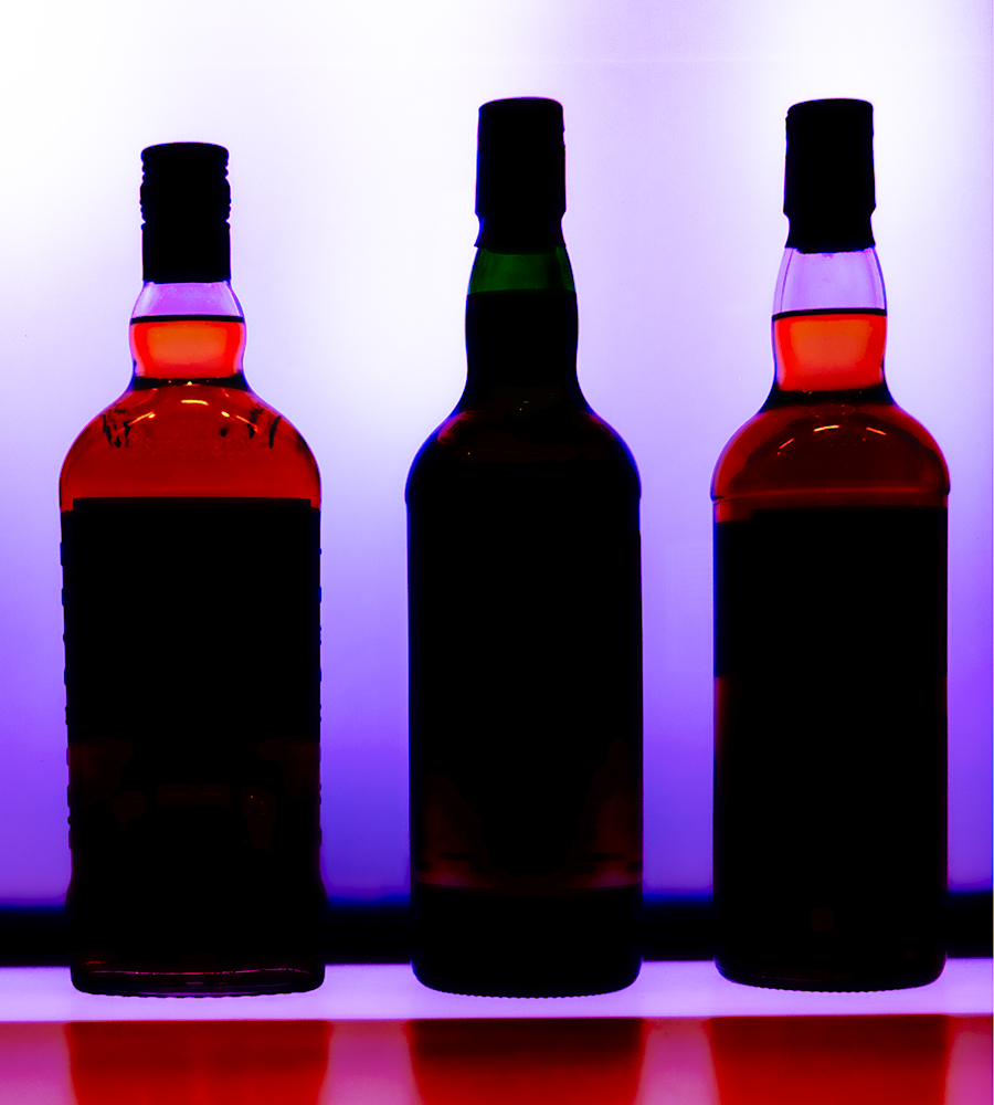 Whisky bottles in silhouette. File photo ©2022, Mark Gillespie/CaskStrength Media.