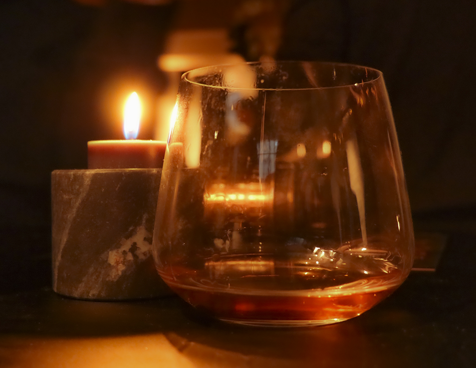 A candlelit dram of whisky. File photo ©2022, Mark Gillespie/CaskStrength Media.
