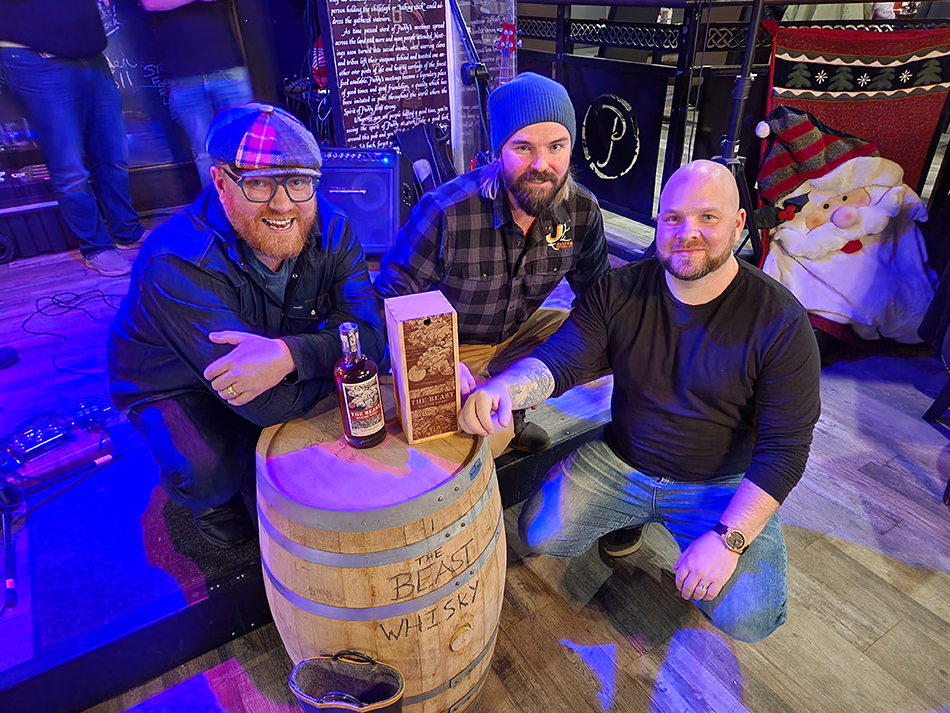 (L-R) Distillers Bryce Parsons, Spike Baker and Scott Germain, Head of the Fort McMurray Firefighters Charities Fund with "The Beast" whisky. Photo courtesy Bearhill.