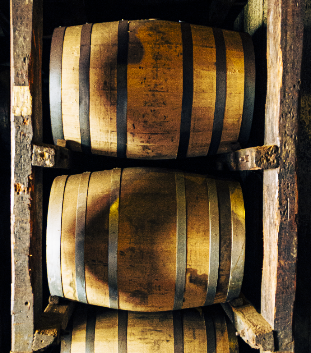 Barrels of whisky rest in ricks while aging. Whisky Clubs often purchase individual barrels to bottle.