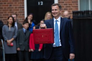 Chancellor of the Exchequer Jeremy Hunt with the "red box" containing his budget address to Parliament March 15, 2023. Image courtesy UK.gov. 