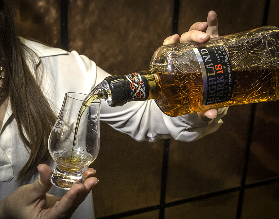 Pouring whisky into a Glencairn glass. File photo/©2023, Mark Gillespie/CaskStrength Media.