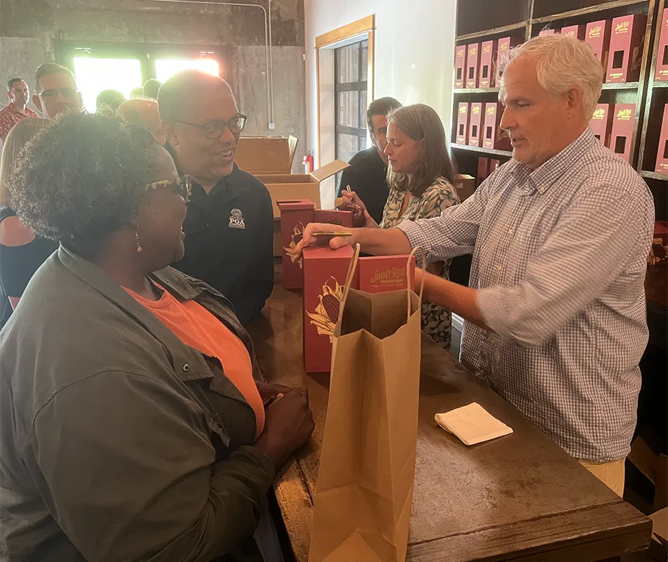 Scott Blackwell and Ann Marshall sign bottles during High Wire Distilling's 10th anniversary celebration September 9 in Charleston, SC. Photo ©2023, Mark Gillespie/CaskStrength Media.