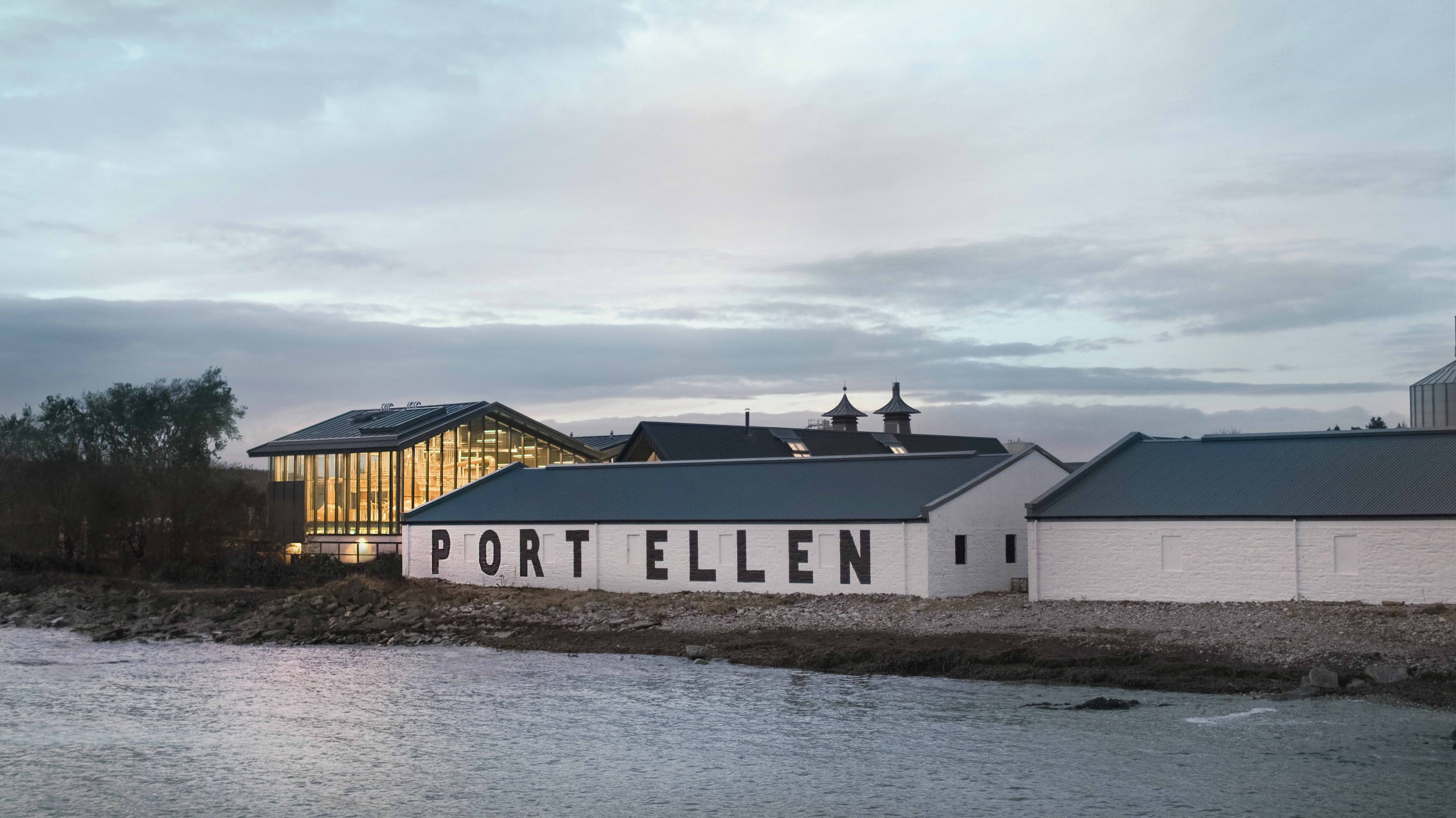 The new Port Ellen still house next to the distillery's iconic warehouse. Image courtesy Diageo.