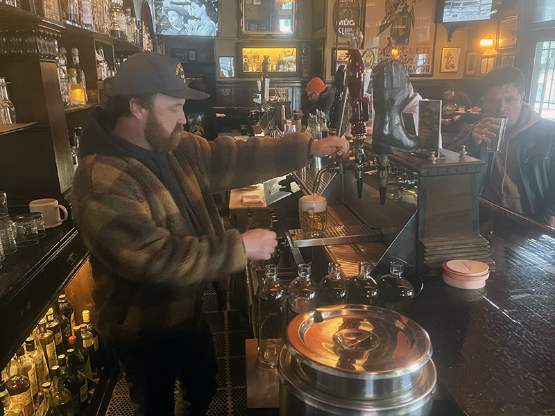 Elixir head bartender Nick Madden pours a beer. Photo ©2025, Mark Gillespie/CaskStrength Media.