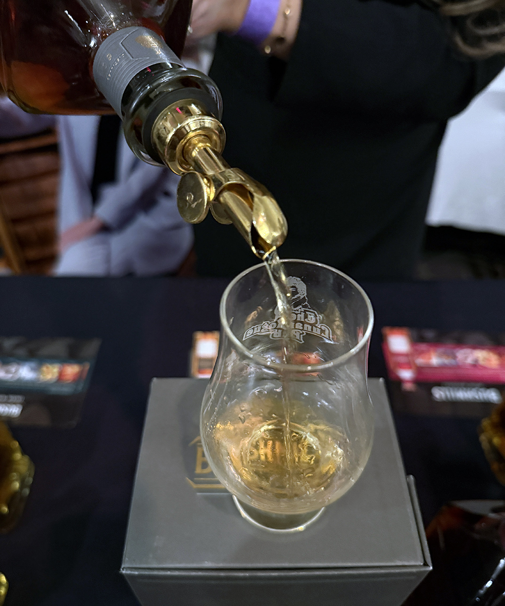 A bottle of whisky being poured into a glass. Photo ©2025, Mark Gillespie/CaskStrength Media.